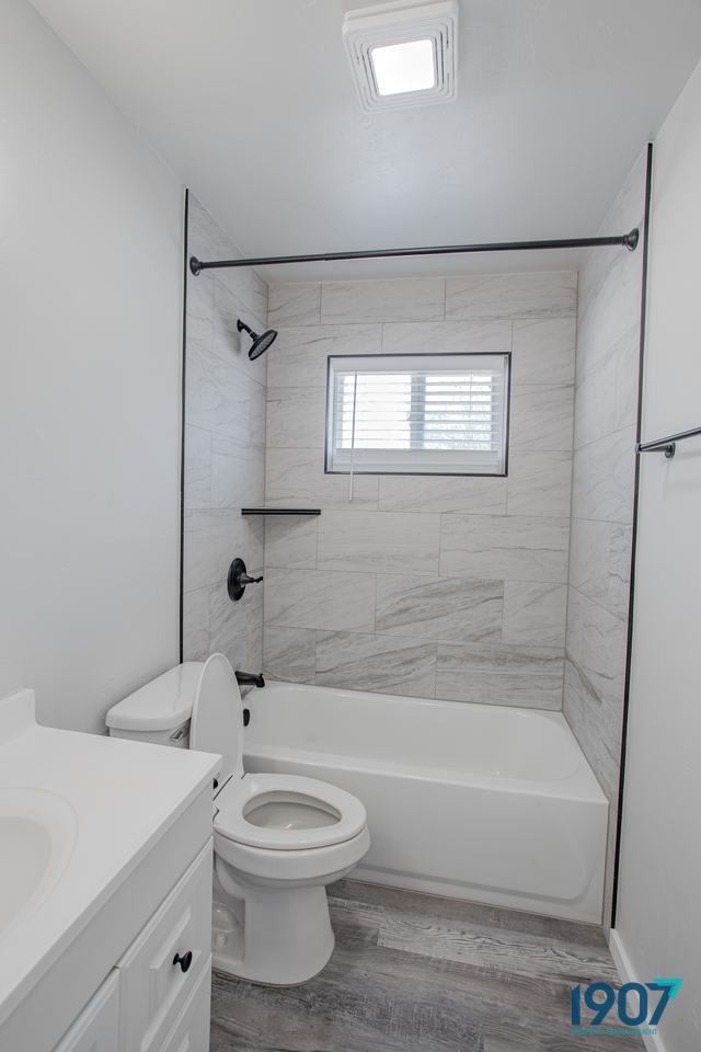 Tub with a gray tile surround