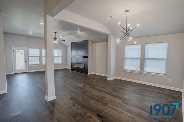 Open living and dining area with a modern chandelier